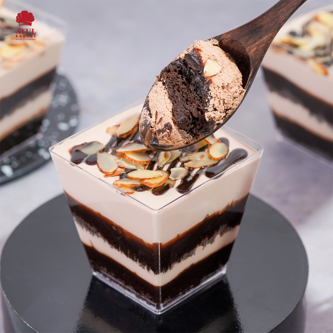 chocolate dessert with different layers and cream